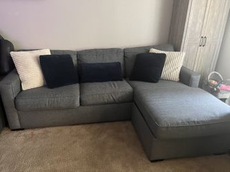 Living Spaces Gray Sectional Sofa With Pullout Bed