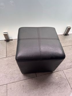 2 leather ottomans