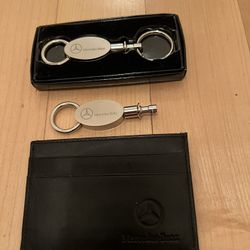 2—- MERCEDES KEY CHAINS AND ONE MERCEDES Credit Card Holder