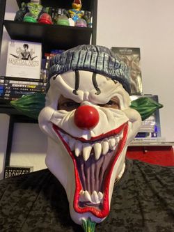 Scary clown with blue hat