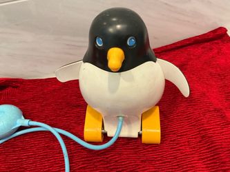 Fisher price vintage pull toy of Perky Penguin