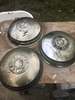 4 packard hubcaps