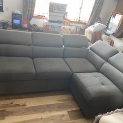 Couch Love Seat Combo. Has A Hide Bed Ottoman And Small stools On The Side