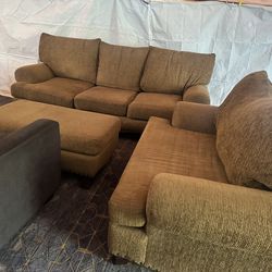 Oversized brown couch with matching ottoman and chair good condition clean we sell all the time delivery $40
