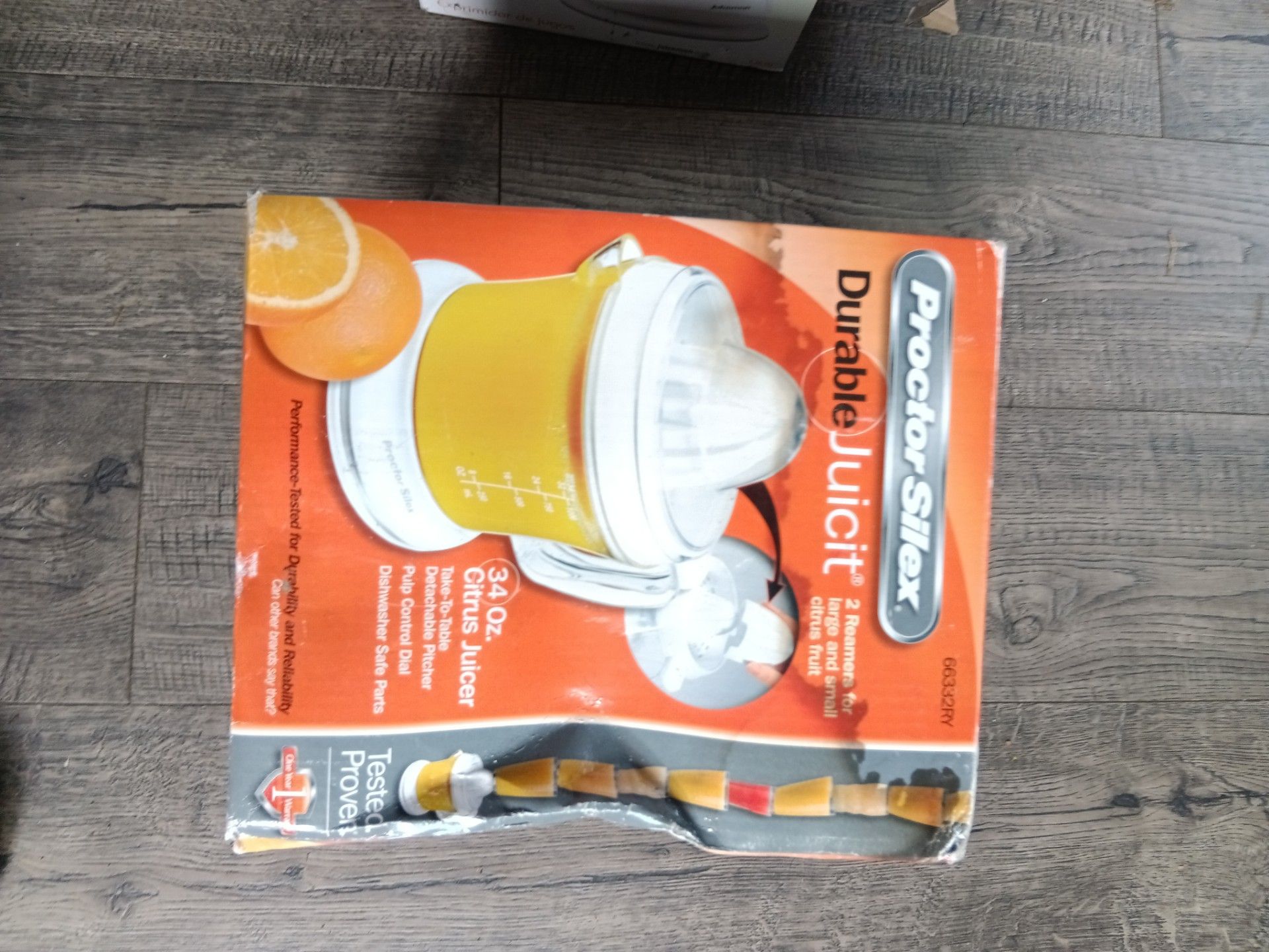 Two branded juicers still in the box