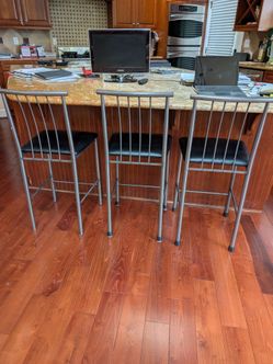 3 Under Counter Gray Metal Chirs