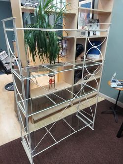 Metal unit with glass shelves