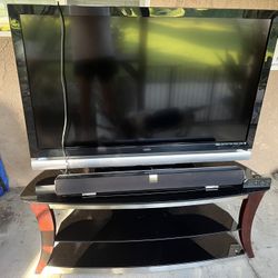 Visio 55 Inch Smart TV, Visio Volume Power Bar, And Earthquake Proof Stand. 