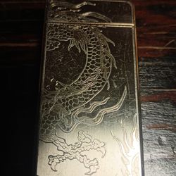 Vintage cigarette lighter engraved dragon on a polished silver surface MODERN USB RECHARGEABLE PLASMA ARC LIGHTER FOR SALE.
