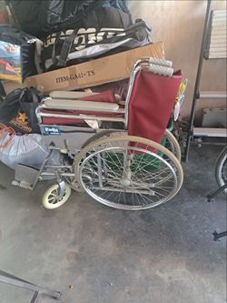 Solid steel wheelchair that folds up with foot pedals
