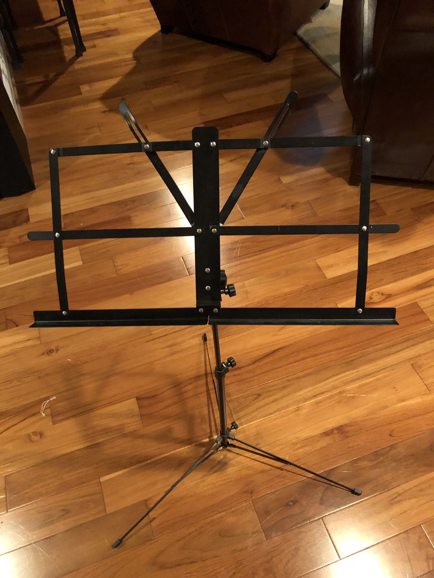 Music stand. Telescoping stand. Adjustable and collapsible. Easy to store and travel with.