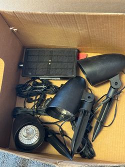 Solar spot lights new  One Set Left 20.00 due to one steak is missing for ground for the solar light maybe someone has another or buy one dollar store