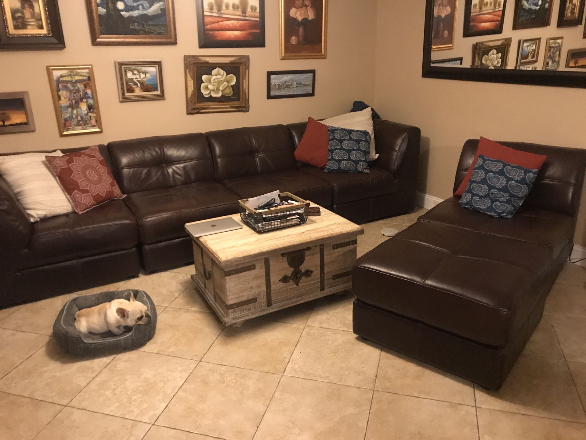 Chocolate brown leather sectional or separate sofa with chair and ottoman.
