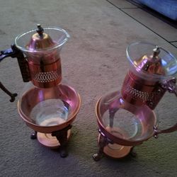 2 VINTAGE COPPER & GLASS COFFEE/TEA WARMER ON STAND .   THIS SET MEASURES 13" HIGH HOLDS ABOUT A QQUART OF LIQUID.  NO CHIPS OR CRACKS.  A VERY UNIQUE