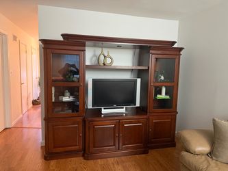 Entertainment center, dark cherry color, with light, clean smoke free home, $300