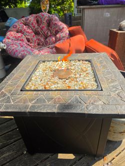 Beautiful mosaic tile top gas fire pit.. the price is firm