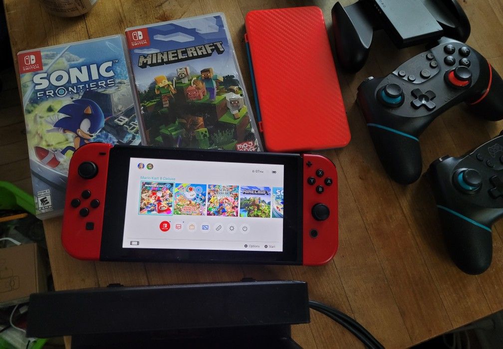Nintendo Switch + Dock + 4 games + 2 Bluetooth controllers