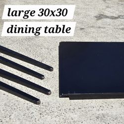 LARGE BLK WOODEN 4 PERSON DINING TABLE 