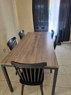 Dining Table with 5 Black Chairs