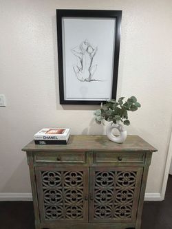 Distressed Wood Cabinet with Carved Doors