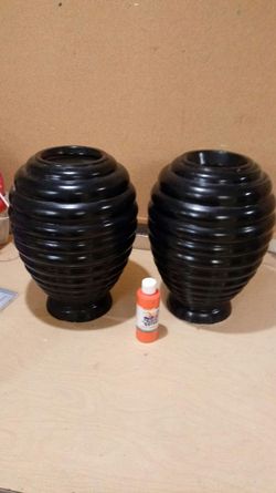 Sold as a pair...2 fiberglass vases about 14" high, a little weight to them sturdy enough to support glass table top