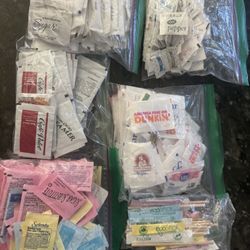 Small sachets lot of sugar, Splenda and salt and peppers.
