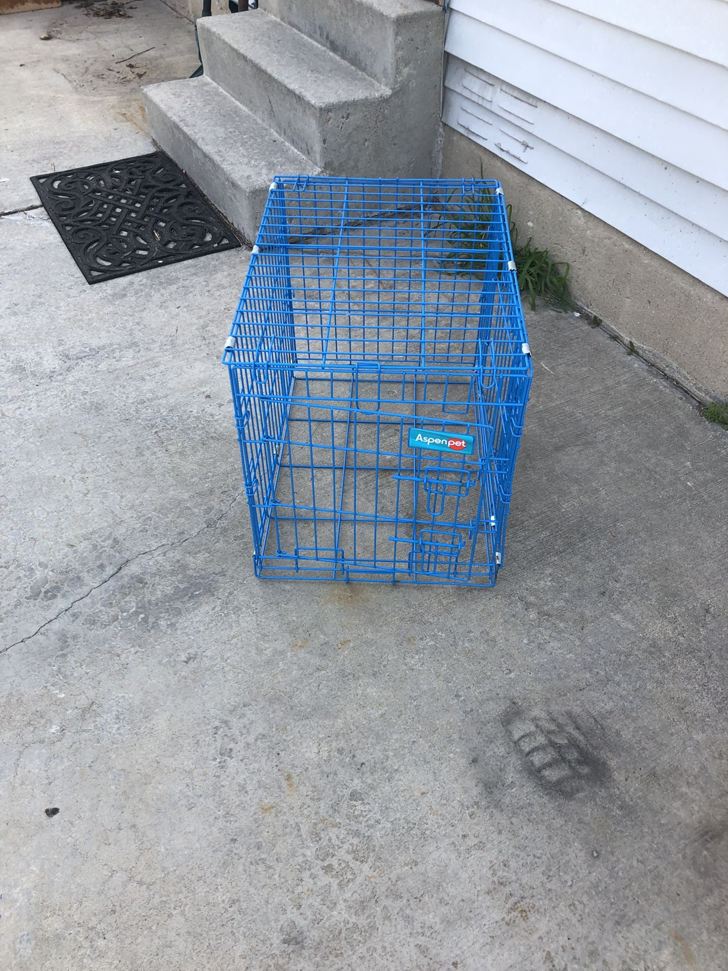 Small blue dog crate