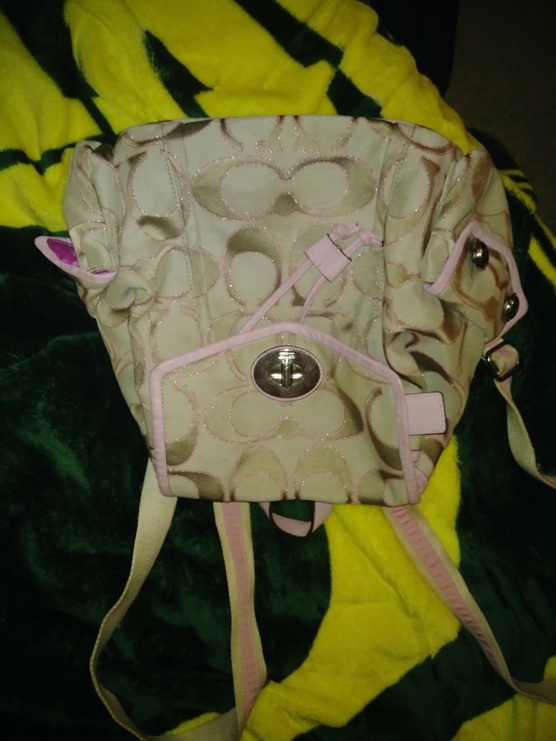 BEAUTIFUL COACH PURSE-BACKPACK PURSE! paid 250.00 asking 75.00 used 1 time for half a day. New condition. No wear or tear on it.