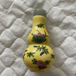Antique Chinese Yellow color Snuff bottle With Floral Design And Jade Like Top 