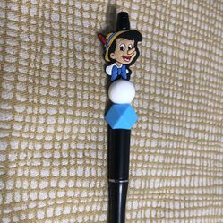 Pinocchio beads pen. Color black. Size 6”LX 1” W