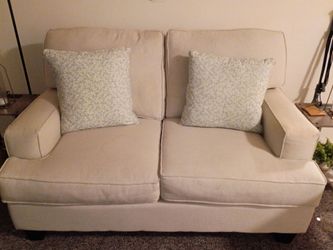 Love seat with pillows