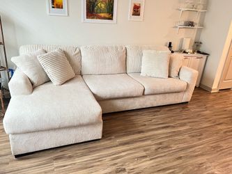 Cream colored L-shaped sectional couch
