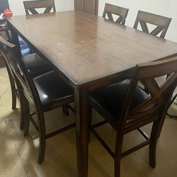 Brown table 6 chairs. 100.00