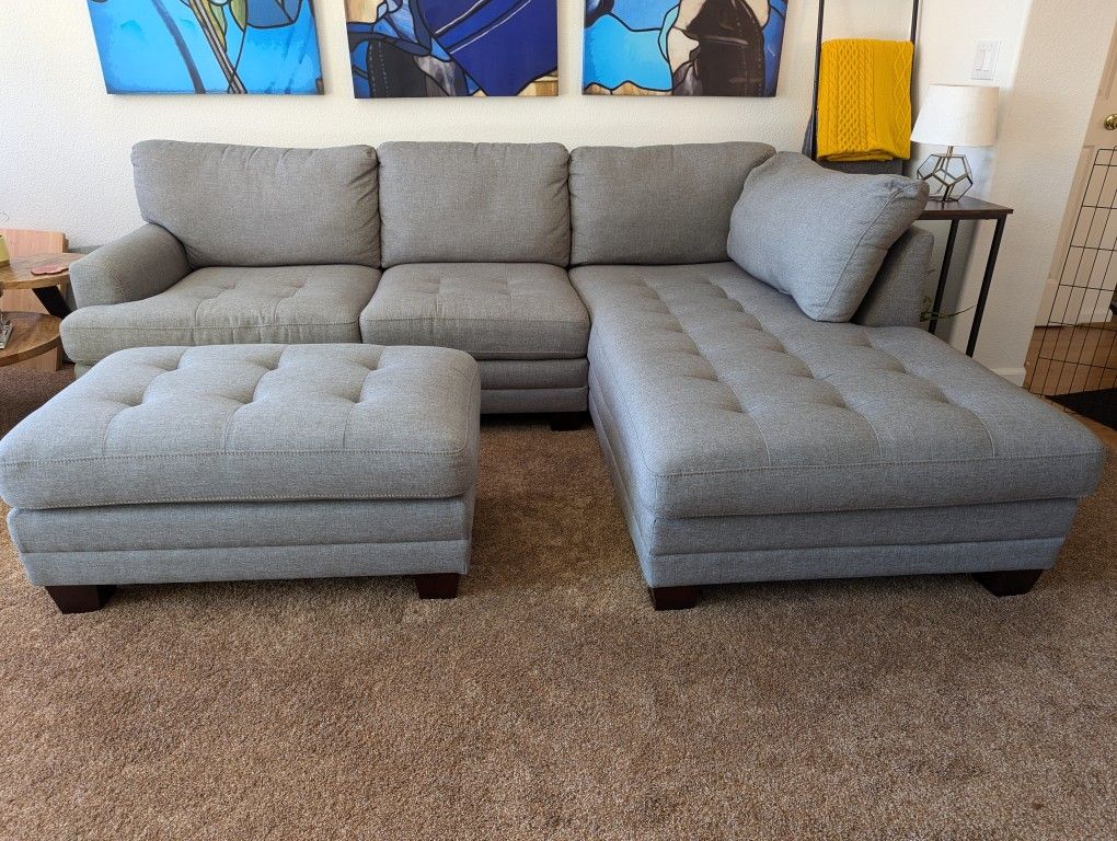 Comfy gray L-shaped couch with ottoman