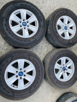17” ford stock rims and tires like new very clean 2657017 Goodyear tires