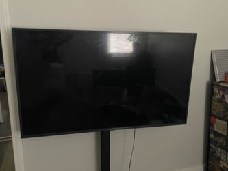 LG 55” TV & Stand:  4K Smart UHD TV in excellent condition