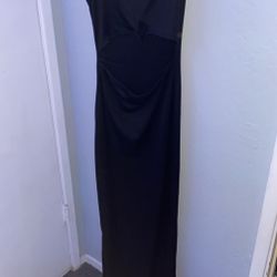 black sundress, open on stomach area & has slits at the bottom