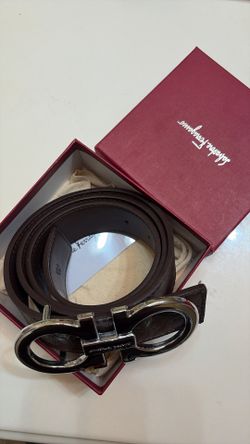 salvatore ferragamo brown leather belt with repeating embossed logo pattern #luxury #designer