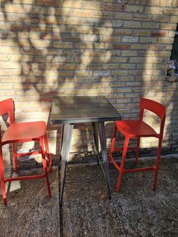 Metal bar table and 2 red plastic barstool 
