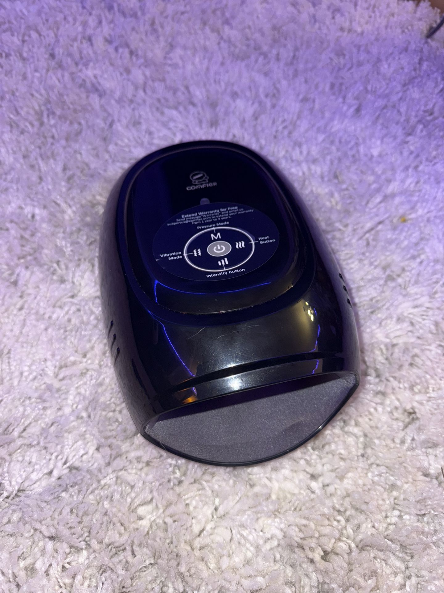 Comfier hand massager in sleek black. Offers multiple settings for relaxation.