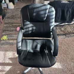 Clean black adjustable office chair with vibration/ massage