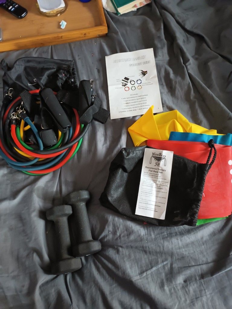 Set Of Exercise Items Including Weights Ropes And Bands