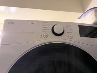 LG Washer & Electric Dryer – $550
