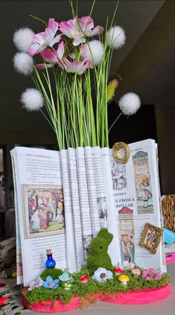 beautifully creative, three-dimensional book sculpture display inspired by Alice in Wonderland