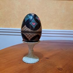 Enamel egg on stand, 8 in tall