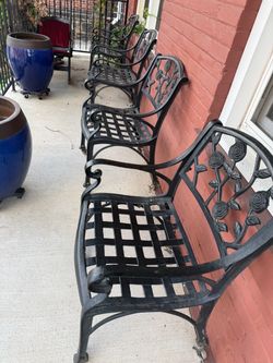 4 iron chairs on wheels