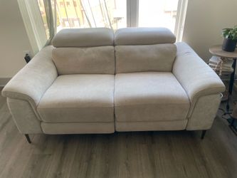 Beige reclining sofa and loveseat set
