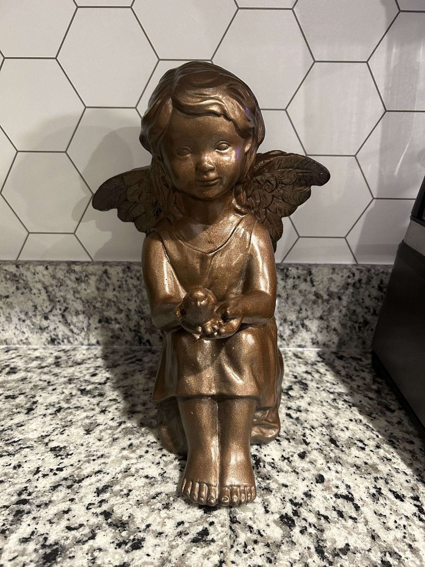 Sitting Angel holding A Dove