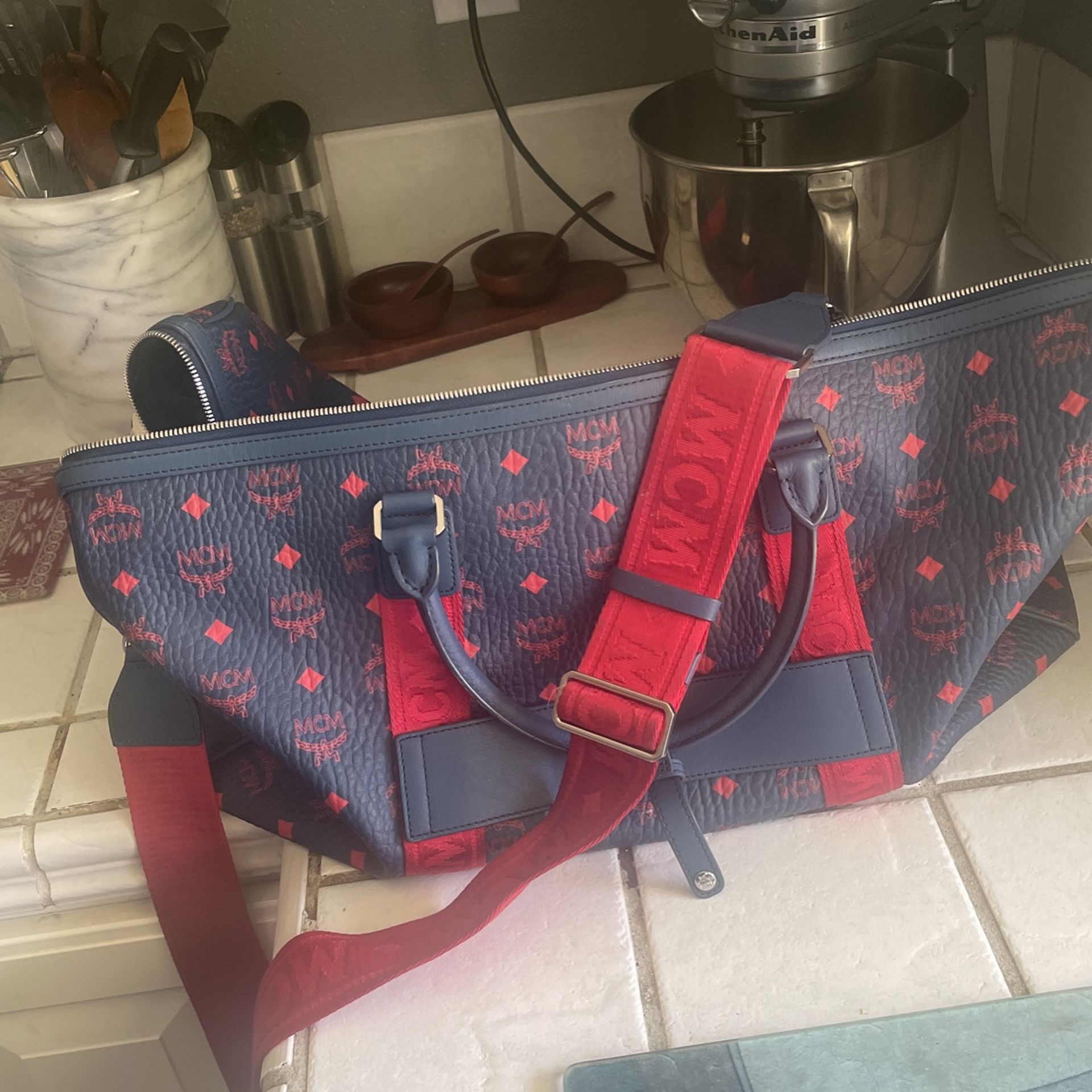 mcm bag bundle/ duffle and backpack same color… duffle is in perfect condition where as the backpack is in used but great condition.