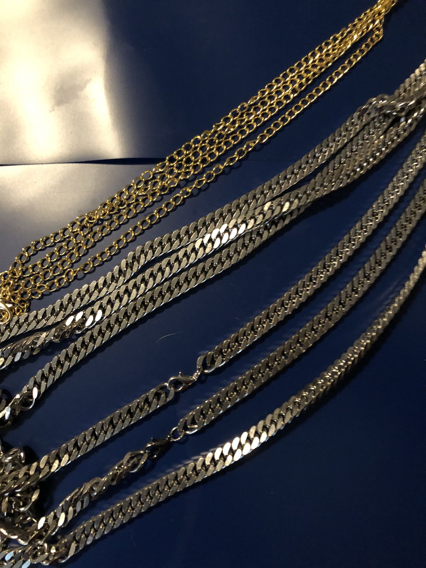 5mm curb style silver 18” bracelet, 8”chain. 3mm gold chain